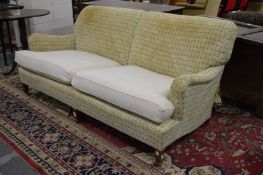 Howard & Sons, a large two seater settee, 20th century.