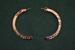 A pair of Ted Baker earrings.