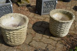 A pair of reconstituted stone basket weave style planters.