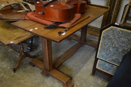 An oak plank top refectory style dining table.