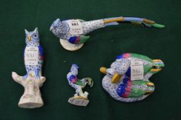 A group of Herend porcelain birds.