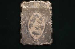 A silver calling card case with engraved decoration.