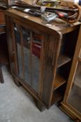 An oak display cabinet/bookcase.