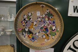 A pair of large Chinese satsuma circular dishes painted with children playing.