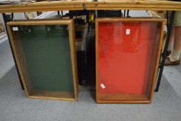 Two display cases with hinged lids.