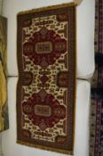 A small Persian style rug, 93cm x 42cm.