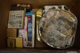 A quantity of coins, cigarette cards, postcards and other collectables to include miniature books.