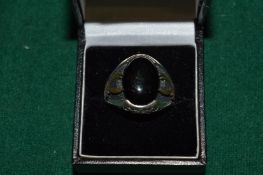 A gentlemans silver dress ring.