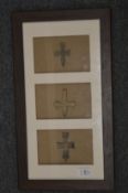 Small bronze crosses, framed and glazed.