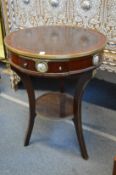 A French style circular single drawer occasional table.