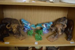 A pair of colourful pottery birds, pair of water buffalo and other decorative items.