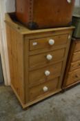 A pine four drawer pedestal chest.
