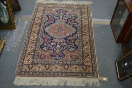 A small Persian style rug, 140cm x 95cm.