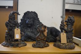Cast iron Punch and Judy door stops and two other items.