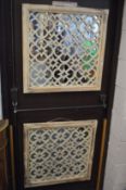 A pair of Moroccan style lattice work garden mirrors.