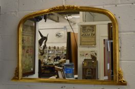 A Victorian style gilt framed over-mantel mirror.