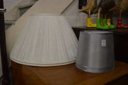 Two pairs of lamp shades.