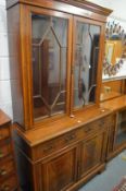 An Edwardian inlaid mahogany cupboard bookcase.