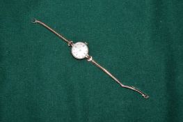 A 9ct gold ladies wristwatch and bracelet strap.
