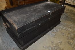 An old pine trunk containing tools.