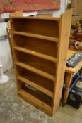 A pine open bookcase.