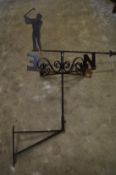 A wrought iron golfing theme weather vane.