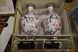Large pair of cloisonne vases with stands in original box.
