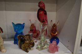 A group of glass animals and birds.