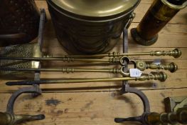 A set of three brass fireside tools.