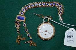 A very good gold, enamel and seed pearl pocket watch with matching fob chain.