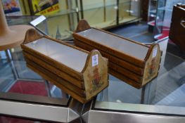 A pair of wooden plant troughs.