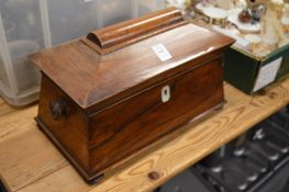 A Victorian rosewood sarcophagus shaped tea caddy.