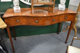 A good mahogany three drawer serpentine fronted side table.