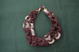 A red and white crystal necklace.