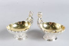 A PAIR OF SILVER PLATE OVAL PIERCED BASKETS. 9ins long.