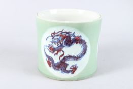 A GOOD CHINESE GREEN, BLUE AND WHITE BRUSH POT with three panels of dragons.
