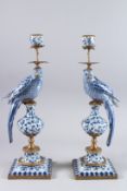 A GOOD PAIR OF BLUE AND WHITE PARROT PORCELAIN CANDLESTICKS on square bases. 19ins high.