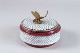 A SEVRES DESIGN CIRCULAR PORCELAIN BOX AND COVER with dragonfly handle. 5ins diameter.
