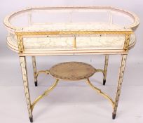 A SUPERB FAUX IVORY BIJOUTERIE TABLE with glass top and sides, on slender legs with cross