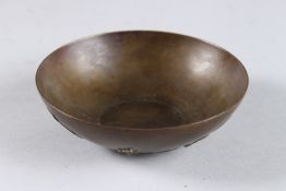A CHINESE BRONZE GILDED CIRCULAR BOWL. 4.75ins.