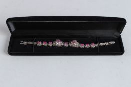 A SILVER RUBY SET AND MARCASITE DOUBLE PANTHER BRACELET.