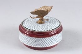 A SEVRES DESIGN CIRCULAR PORCELAIN BOX AND COVER with butterfly handle. 5ins diameter.