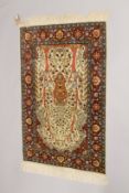 A GOOD PERSIAN SILK TREE OF LIFE RUG with motifs of birds, flowers, tree branches and motifs. 4ft