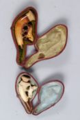 TWO MEERSCHAUM PIPES in leather case.