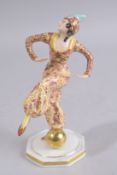 A HUTSCHENREUTHER SELB BAVARIA PORCELAIN DANCING FIGURE on an octagonal base. 7ins high.