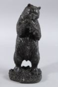A BRONZE STANDING BEAR. 10.5ins high.