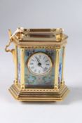 A FRENCH GILT METAL CARRIAGE CLOCK with painted porcelain panels. 5ins high.