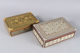 AN ISLAMIC INLAID JEWELLERY BOX and a similar box (2). 10ins long.