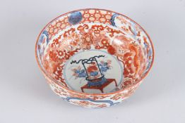 A JAPANESE IMARI CIRCULAR BOWL painted with dragons and motifs. 8.5ins diameter.