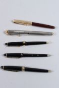 A BAG OF FIVE VARIOUS PENS.